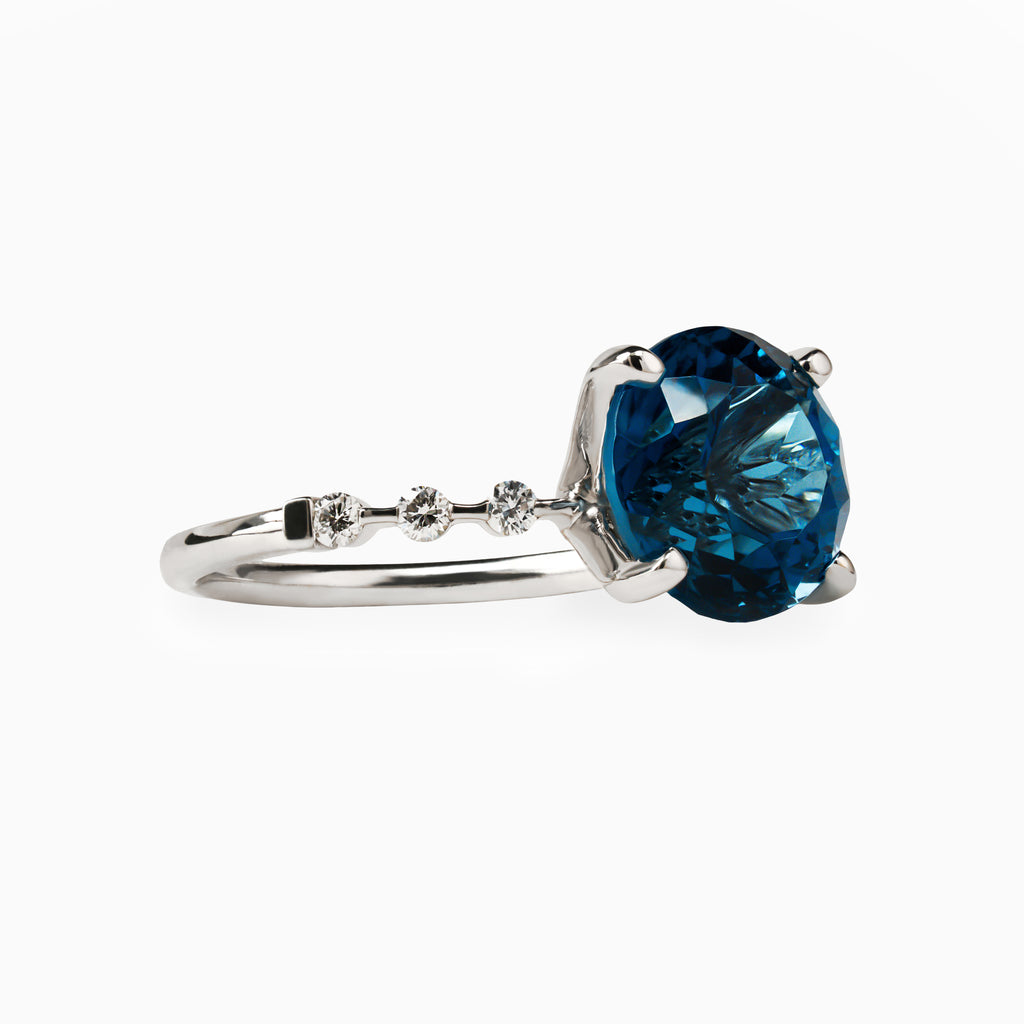 5.09ct. Blue Topaz Ring with Lab Side Diamonds