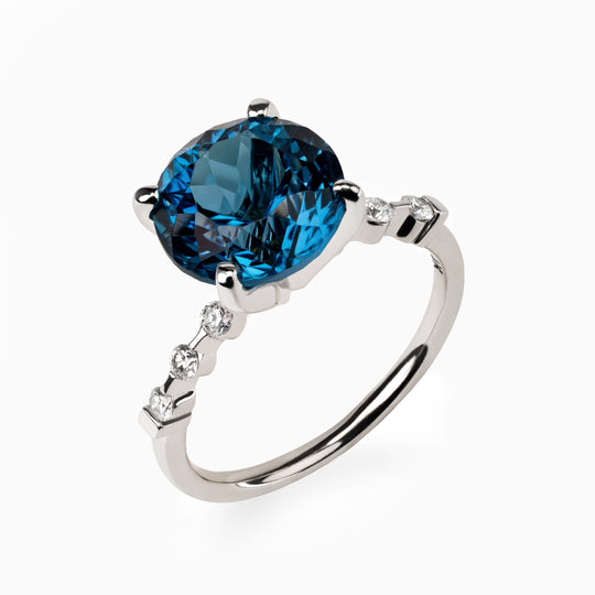 5.09ct. Blue Topaz Ring with Lab Side Diamonds