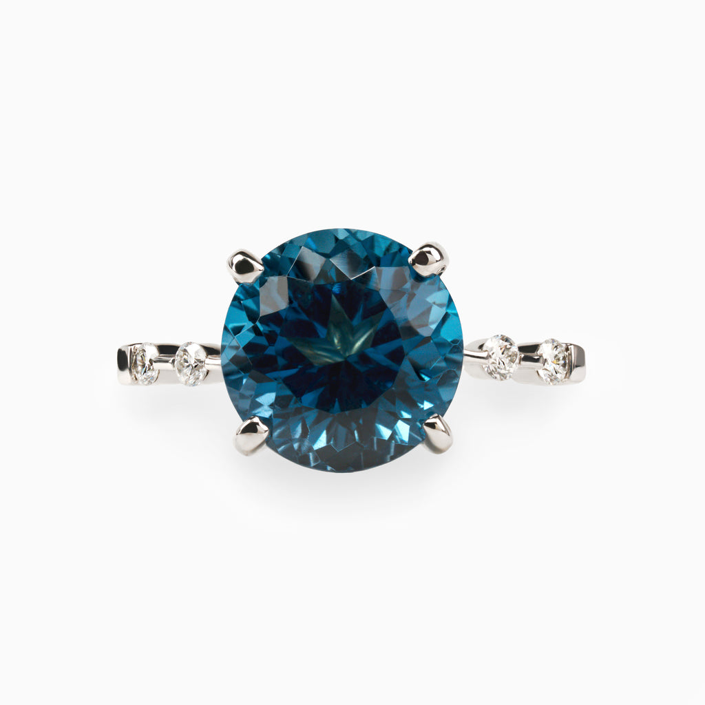 5.09ct. Blue Topaz Ring with Lab Side Diamonds