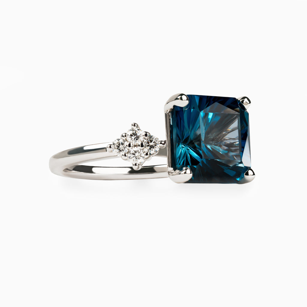 4.40ct Blue Topaz Ring with Lab Side Diamonds