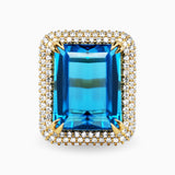 21.37ct Emerald Cut Blue Topaz Ring with Diamond Halo